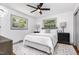 Cozy bedroom features neutral decor, natural light, and a soft rug for added comfort at 2205 W Carver St, Durham, NC 27705