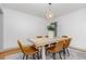 Bright dining room featuring a modern chandelier, seating for six, and neutral decor at 2205 W Carver St, Durham, NC 27705