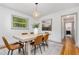 Bright dining room featuring a modern chandelier, seating for six, and neutral decor at 2205 W Carver St, Durham, NC 27705