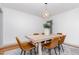 Bright dining room featuring hardwood floors and a modern light fixture at 2205 W Carver St, Durham, NC 27705