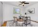 Bright home office features a ceiling fan, and view from window, perfect for remote work or study at 2205 W Carver St, Durham, NC 27705