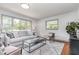 Cozy living room with large windows, neutral colors, and hardwood floors at 2205 W Carver St, Durham, NC 27705