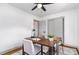 Light and airy home office with a ceiling fan, desk, chairs, and soft, natural lighting at 2205 W Carver St, Durham, NC 27705