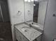 Bathroom featuring a vanity with a granite countertop and a mirror at 225 Virens Drive, Cary, NC 27511