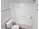 Bathroom featuring a bathtub with white tiled walls, and a toilet at 225 Virens Drive, Cary, NC 27511