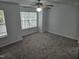 Large bedroom with carpet, ceiling fan, and window at 225 Virens Drive, Cary, NC 27511