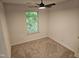 Bedroom featuring a window and a ceiling fan at 225 Virens Drive, Cary, NC 27511