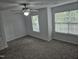 Bedroom featuring two windows and a ceiling fan at 225 Virens Drive, Cary, NC 27511