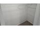Walk in closet with white metal rack and beige carpet at 225 Virens Drive, Cary, NC 27511