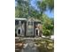 Traditional two-story townhome featuring a mix of siding and brick, complemented by a walkway and verdant landscaping at 225 Virens Drive, Cary, NC 27511