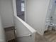 Hallway with stairs and a view to a bathroom and bedroom at 225 Virens Drive, Cary, NC 27511