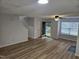 Inviting living room with durable vinyl flooring, fresh white walls, and a welcoming entry with natural light at 225 Virens Drive, Cary, NC 27511