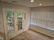 Bright sunroom with french doors leading to the outside patio at 225 Virens Drive, Cary, NC 27511