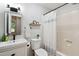 Neat bathroom featuring a shower with white curtain, a single sink and toilet at 2409 New Hope Church Rd, Chapel Hill, NC 27514