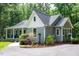Beautiful landscaped home with a gray roof and siding, showcasing a well-maintained exterior at 2409 New Hope Church Rd, Chapel Hill, NC 27514
