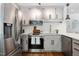 Bright updated kitchen with subway tile backsplash, stainless appliances, and updated cabinets at 2409 New Hope Church Rd, Chapel Hill, NC 27514