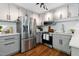 Charming kitchen featuring stainless steel appliances, light gray cabinetry, and modern countertops at 2409 New Hope Church Rd, Chapel Hill, NC 27514