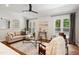 Bright living room with hardwood floors, neutral color palette, vaulted ceilings and large windows at 2409 New Hope Church Rd, Chapel Hill, NC 27514