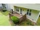 The wooden back deck has lush landscaping for peaceful outdoor enjoyment and relaxing at 2420 Sapphire Valley Dr, Raleigh, NC 27604