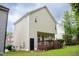 Two-story home featuring a wooden back deck and grassy lawn perfect for outdoor living and entertainment at 2420 Sapphire Valley Dr, Raleigh, NC 27604
