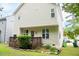 Exterior view of home with wooden back deck, lush green lawn, and natural light at 2420 Sapphire Valley Dr, Raleigh, NC 27604