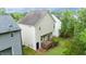 Back exterior featuring a wooden deck, small green area, and an access door at 2420 Sapphire Valley Dr, Raleigh, NC 27604