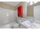 Bathroom featuring a tub and shower combination, a white vanity, and a bright red medicine cabinet at 2420 Sapphire Valley Dr, Raleigh, NC 27604