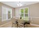 Well-lit dining area featuring a neutral color palette and views to the outdoors at 2420 Sapphire Valley Dr, Raleigh, NC 27604