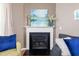 Close up of the fireplace in the living room, featuring a white mantle and decorative accents at 2420 Sapphire Valley Dr, Raleigh, NC 27604