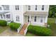 Inviting home entrance featuring brick stairs and a charming front porch at 2420 Sapphire Valley Dr, Raleigh, NC 27604
