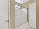 Bathroom featuring a shower with a sliding glass door and a view of the toilet and an additional door at 2420 Sapphire Valley Dr, Raleigh, NC 27604