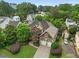 Aerial view of a home with a well-manicured lawn, mature trees, and a two-car garage at 2507 Mayview Rd, Raleigh, NC 27607