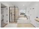 Bright bathroom featuring a walk-in shower and a jacuzzi tub at 2507 Mayview Rd, Raleigh, NC 27607