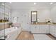 Elegant bathroom featuring a soaking tub and plenty of counter space at 2507 Mayview Rd, Raleigh, NC 27607