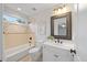 Bathroom with vanity, toilet, tub, and a framed mirror at 2507 Mayview Rd, Raleigh, NC 27607