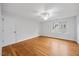 Bedroom featuring hardwood floors, a window, and neutral-colored walls at 2507 Mayview Rd, Raleigh, NC 27607