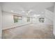 Spacious bedroom featuring large windows and ceiling fans at 2507 Mayview Rd, Raleigh, NC 27607