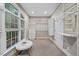 Spacious closet features custom shelving and bench with lots of natural light at 2507 Mayview Rd, Raleigh, NC 27607