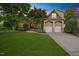 Charming home featuring a well-maintained lawn, manicured landscaping and a two-car garage at 2507 Mayview Rd, Raleigh, NC 27607