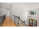 Open foyer with hardwood floors, a chandelier, a staircase, and a large window at 2507 Mayview Rd, Raleigh, NC 27607