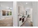 Open-concept living space with a built-in wine rack and hallway leading to other rooms at 2507 Mayview Rd, Raleigh, NC 27607