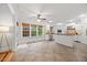 Open-concept space with white cabinetry, tile floors, and window with lots of natural light at 2507 Mayview Rd, Raleigh, NC 27607