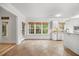 Open kitchen area with a breakfast bar, abundant natural light, and views of the outdoor scenery at 2507 Mayview Rd, Raleigh, NC 27607