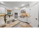 Modern kitchen featuring granite counters, stainless appliances, and bright white cabinets with a kitchen island at 2507 Mayview Rd, Raleigh, NC 27607