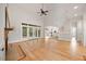 Bright living room with hardwood floors, a fireplace, and large glass doors that open to the outdoor area at 2507 Mayview Rd, Raleigh, NC 27607