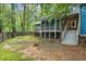 Scenic backyard featuring mature trees, a lush lawn, and wooden fencing at 2525 Buxton Ct, Chapel Hill, NC 27514
