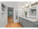 Bright bathroom with a double vanity, marble countertop, and view of nature at 2525 Buxton Ct, Chapel Hill, NC 27514