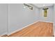 This empty bedroom has a window and beautiful hardwood floors at 2525 Buxton Ct, Chapel Hill, NC 27514