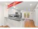 Kitchen featuring stainless steel appliances, modern gray countertops, and stylish pendant lighting at 2525 Buxton Ct, Chapel Hill, NC 27514