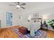 The primary bedroom features hardwood floors, a ceiling fan, and a private bathroom at 2525 Buxton Ct, Chapel Hill, NC 27514